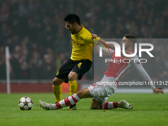 Ilkay Gundogan (L) of Borussia Dortmund competes for the ball with Aaron Ramsey (R) of Arsenal during the UEFA Champions League Group D socc...