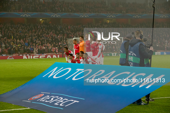 Soccer players from Arsenal pose for a team photo behind the UEFA ''No To Racism'' and ''Respect'' banner prior to the UEFA Champions League...