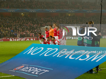 Soccer players from Arsenal pose for a team photo behind the UEFA ''No To Racism'' and ''Respect'' banner prior to the UEFA Champions League...