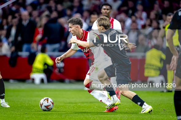 AFC Ajax Amsterdam forward Carlos Forbs and Besiktas JK defender Jonas Svensson during the match between Ajax and Besiktas at the Johan Crui...