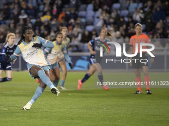 Khadija Shaw #21 of Manchester City W.F.C. scores from the penalty spot during the UEFA Women's Champions League Second Round 2nd Leg match...