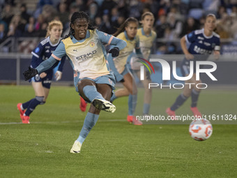 Khadija Shaw #21 of Manchester City W.F.C. scores from the penalty spot during the UEFA Women's Champions League Second Round 2nd Leg match...