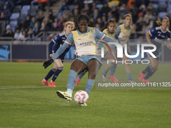 Khadija Shaw #21 of Manchester City W.F.C. scores from the penalty spot during the UEFA Women's Champions League Second Round 2nd Leg match...