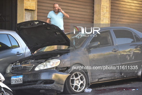 Lebanese forces secure the area and take precautionary measures following an Israeli army drone strike that targets a vehicle on the Kahale-...