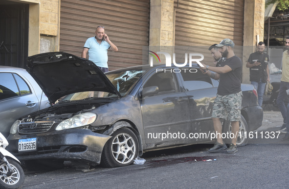 Lebanese forces secure the area and take precautionary measures following an Israeli army drone strike that targets a vehicle on the Kahale-...