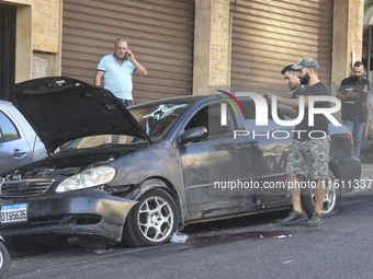 Lebanese forces secure the area and take precautionary measures following an Israeli army drone strike that targets a vehicle on the Kahale-...