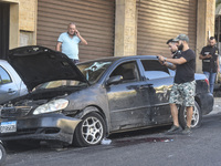 Lebanese forces secure the area and take precautionary measures following an Israeli army drone strike that targets a vehicle on the Kahale-...