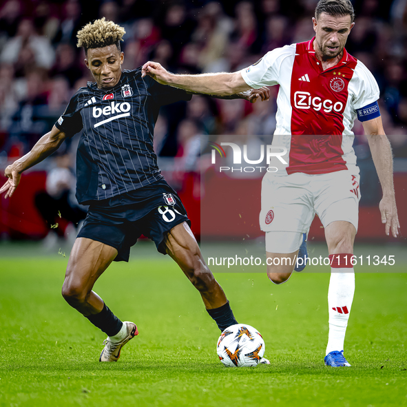 Besiktas JK midfielder Gedson Fernandes and AFC Ajax Amsterdam midfielder Jordan Henderson during the match between Ajax and Besiktas at the...