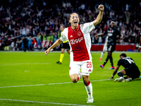 AFC Ajax Amsterdam midfielder Kian Fitz-Jim scores the 1-0 goal and celebrates during the match between Ajax and Besiktas at the Johan Cruij...