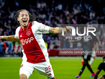 AFC Ajax Amsterdam midfielder Kian Fitz-Jim scores the 1-0 goal and celebrates during the match between Ajax and Besiktas at the Johan Cruij...