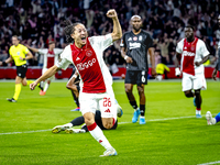 AFC Ajax Amsterdam midfielder Kian Fitz-Jim scores the 1-0 goal and celebrates during the match between Ajax and Besiktas at the Johan Cruij...