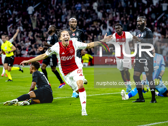 AFC Ajax Amsterdam midfielder Kian Fitz-Jim scores the 1-0 goal and celebrates during the match between Ajax and Besiktas at the Johan Cruij...