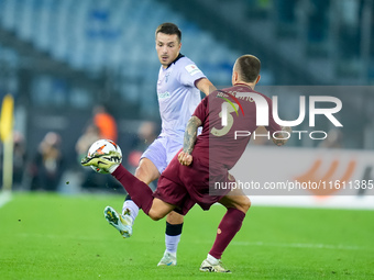 Benat Prados of Athletic Club and Angelino of AS Roma compete for the ball during the UEFA Europa League 2024/25 League Phase MD1 match betw...