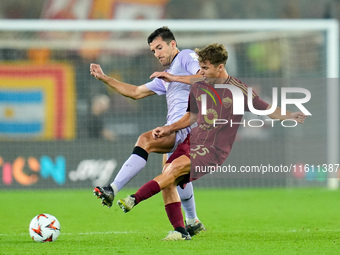 Daniel Vivian of Athletic Club and Tommaso Baldanzi of AS Roma compete for the ball during the UEFA Europa League 2024/25 League Phase MD1 m...