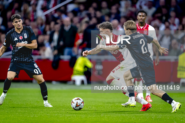 AFC Ajax Amsterdam forward Carlos Forbs and Besiktas JK defender Jonas Svensson during the match between Ajax and Besiktas at the Johan Crui...