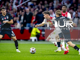 AFC Ajax Amsterdam forward Carlos Forbs and Besiktas JK defender Jonas Svensson during the match between Ajax and Besiktas at the Johan Crui...