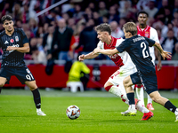 AFC Ajax Amsterdam forward Carlos Forbs and Besiktas JK defender Jonas Svensson during the match between Ajax and Besiktas at the Johan Crui...