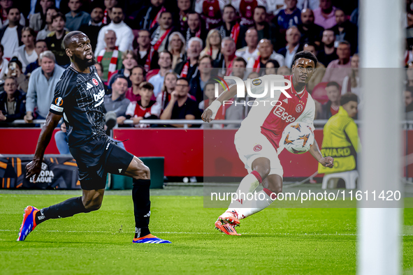 Besiktas JK midfielder Jean Onana and AFC Ajax Amsterdam defender Jorrel Hato during the match between Ajax and Besiktas at the Johan Cruijf...