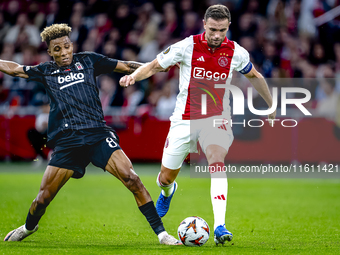 Besiktas JK midfielder Gedson Fernandes and AFC Ajax Amsterdam midfielder Jordan Henderson during the match between Ajax and Besiktas at the...