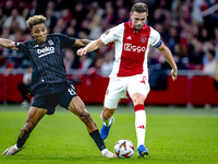 Besiktas JK midfielder Gedson Fernandes and AFC Ajax Amsterdam midfielder Jordan Henderson during the match between Ajax and Besiktas at the...