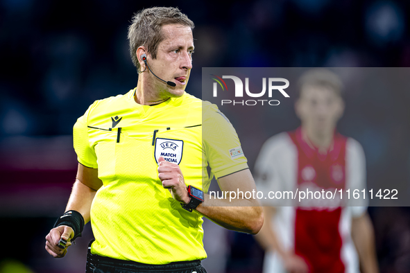 Referee John Brooks officiates the match between Ajax and Besiktas at the Johan Cruijff ArenA for the UEFA Europa League - League phase - Ma...