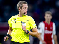 Referee John Brooks officiates the match between Ajax and Besiktas at the Johan Cruijff ArenA for the UEFA Europa League - League phase - Ma...