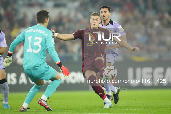 Artem Dovbyk centre-forward of Roma and Ukraine and Julen Agirrezabala goalkeeper of Athletic Club and Spain compete for the ball during the...