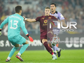 Artem Dovbyk centre-forward of Roma and Ukraine and Julen Agirrezabala goalkeeper of Athletic Club and Spain compete for the ball during the...