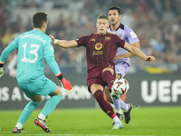 Artem Dovbyk centre-forward of Roma and Ukraine and Julen Agirrezabala goalkeeper of Athletic Club and Spain compete for the ball during the...