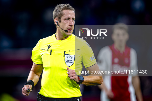 Referee John Brooks officiates the match between Ajax and Besiktas at the Johan Cruijff ArenA for the UEFA Europa League - League phase - Ma...