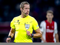 Referee John Brooks officiates the match between Ajax and Besiktas at the Johan Cruijff ArenA for the UEFA Europa League - League phase - Ma...