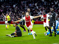 AFC Ajax Amsterdam midfielder Kian Fitz-Jim scores the 1-0 goal and celebrates during the match between Ajax and Besiktas at the Johan Cruij...