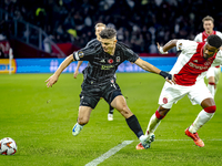 Besiktas JK midfielder Milot Rashica and AFC Ajax Amsterdam defender Jorrel Hato during the match between Ajax and Besiktas at the Johan Cru...