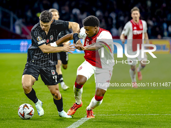 Besiktas JK midfielder Milot Rashica and AFC Ajax Amsterdam defender Jorrel Hato during the match between Ajax and Besiktas at the Johan Cru...