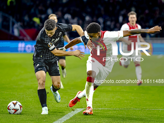 Besiktas JK midfielder Milot Rashica and AFC Ajax Amsterdam defender Jorrel Hato during the match between Ajax and Besiktas at the Johan Cru...