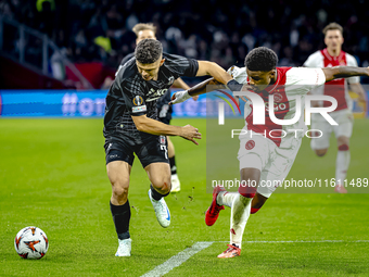 Besiktas JK midfielder Milot Rashica and AFC Ajax Amsterdam defender Jorrel Hato during the match between Ajax and Besiktas at the Johan Cru...