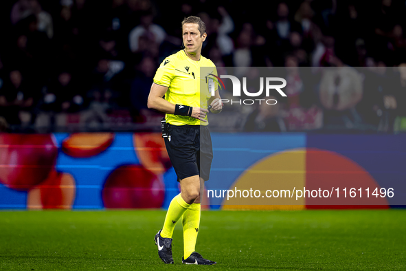 Referee John Brooks officiates the match between Ajax and Besiktas at the Johan Cruijff ArenA for the UEFA Europa League - League phase - Ma...