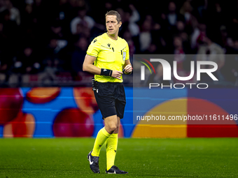 Referee John Brooks officiates the match between Ajax and Besiktas at the Johan Cruijff ArenA for the UEFA Europa League - League phase - Ma...