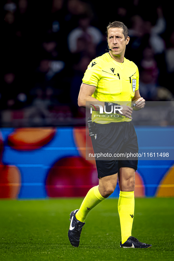 Referee John Brooks officiates the match between Ajax and Besiktas at the Johan Cruijff ArenA for the UEFA Europa League - League phase - Ma...