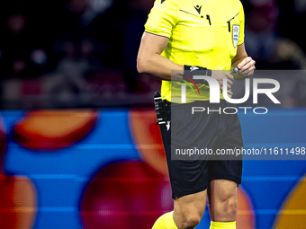 Referee John Brooks officiates the match between Ajax and Besiktas at the Johan Cruijff ArenA for the UEFA Europa League - League phase - Ma...