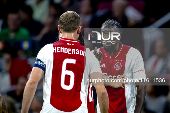 AFC Ajax Amsterdam midfielder Jordan Henderson and AFC Ajax Amsterdam forward Bertrand Traore have a discussion during the match Ajax vs. Be...