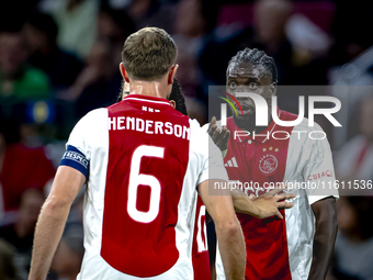 AFC Ajax Amsterdam midfielder Jordan Henderson and AFC Ajax Amsterdam forward Bertrand Traore have a discussion during the match Ajax vs. Be...