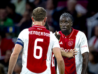 AFC Ajax Amsterdam midfielder Jordan Henderson and AFC Ajax Amsterdam forward Bertrand Traore have a discussion during the match Ajax vs. Be...