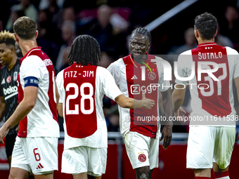 AFC Ajax Amsterdam midfielder Jordan Henderson and AFC Ajax Amsterdam forward Bertrand Traore have a discussion during the match Ajax vs. Be...