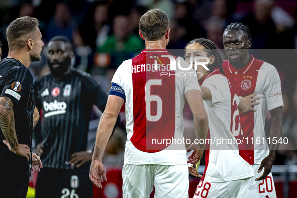 AFC Ajax Amsterdam midfielder Jordan Henderson and AFC Ajax Amsterdam forward Bertrand Traore have a discussion during the match Ajax vs. Be...