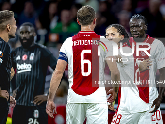 AFC Ajax Amsterdam midfielder Jordan Henderson and AFC Ajax Amsterdam forward Bertrand Traore have a discussion during the match Ajax vs. Be...