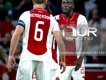 AFC Ajax Amsterdam midfielder Jordan Henderson and AFC Ajax Amsterdam forward Bertrand Traore have a discussion during the match Ajax vs. Be...