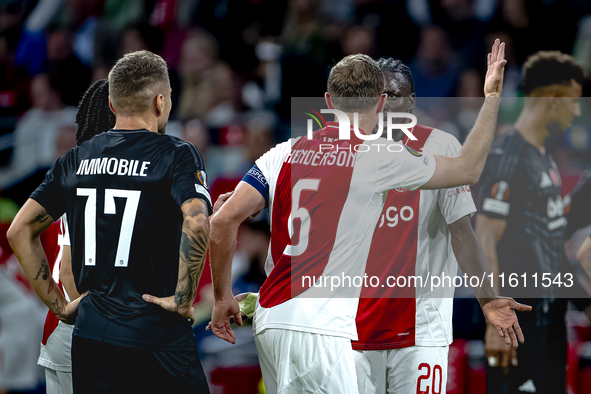 AFC Ajax Amsterdam midfielder Jordan Henderson and AFC Ajax Amsterdam forward Bertrand Traore have a discussion during the match Ajax vs. Be...