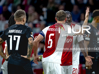 AFC Ajax Amsterdam midfielder Jordan Henderson and AFC Ajax Amsterdam forward Bertrand Traore have a discussion during the match Ajax vs. Be...