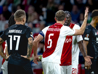 AFC Ajax Amsterdam midfielder Jordan Henderson and AFC Ajax Amsterdam forward Bertrand Traore have a discussion during the match Ajax vs. Be...